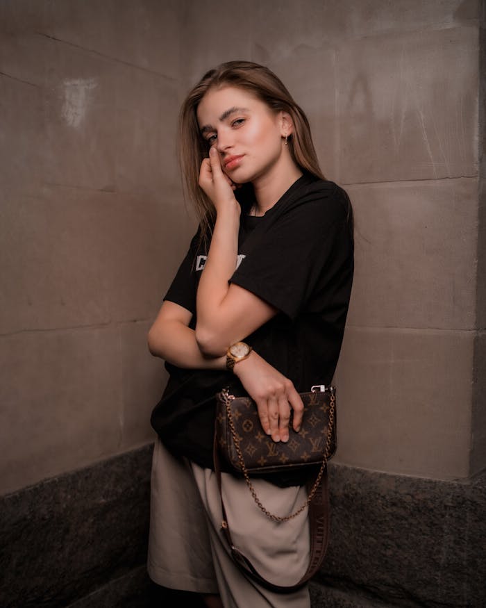 Fashion portrait of a woman with a designer purse in Toronto, showcasing elegance and style.